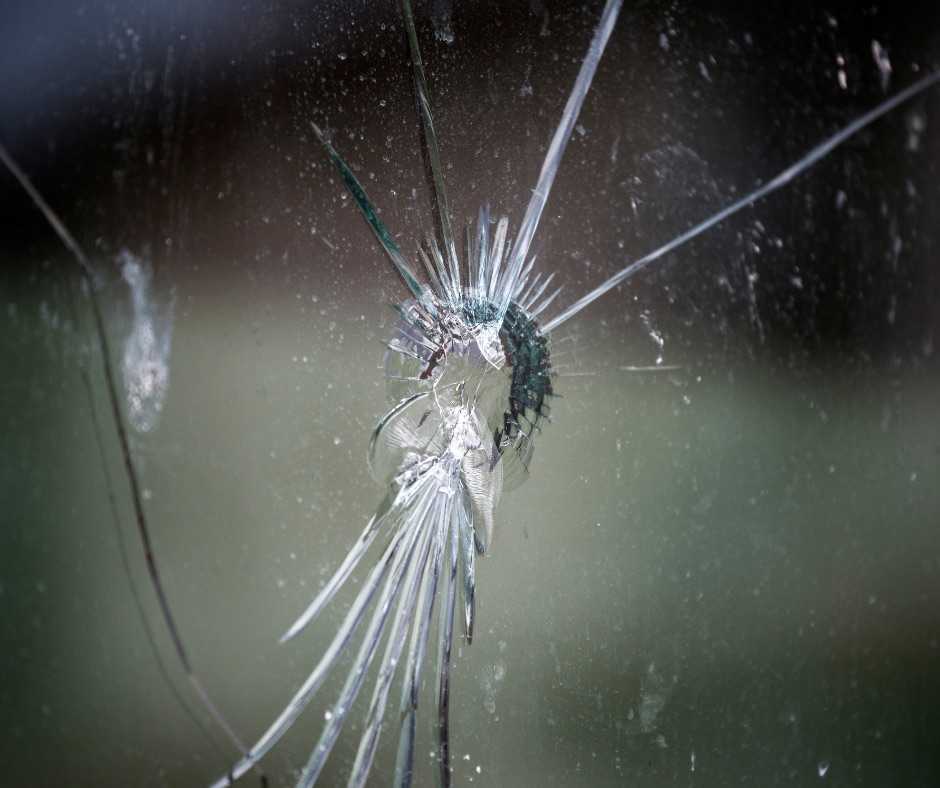 detail of bullet-riddled glass